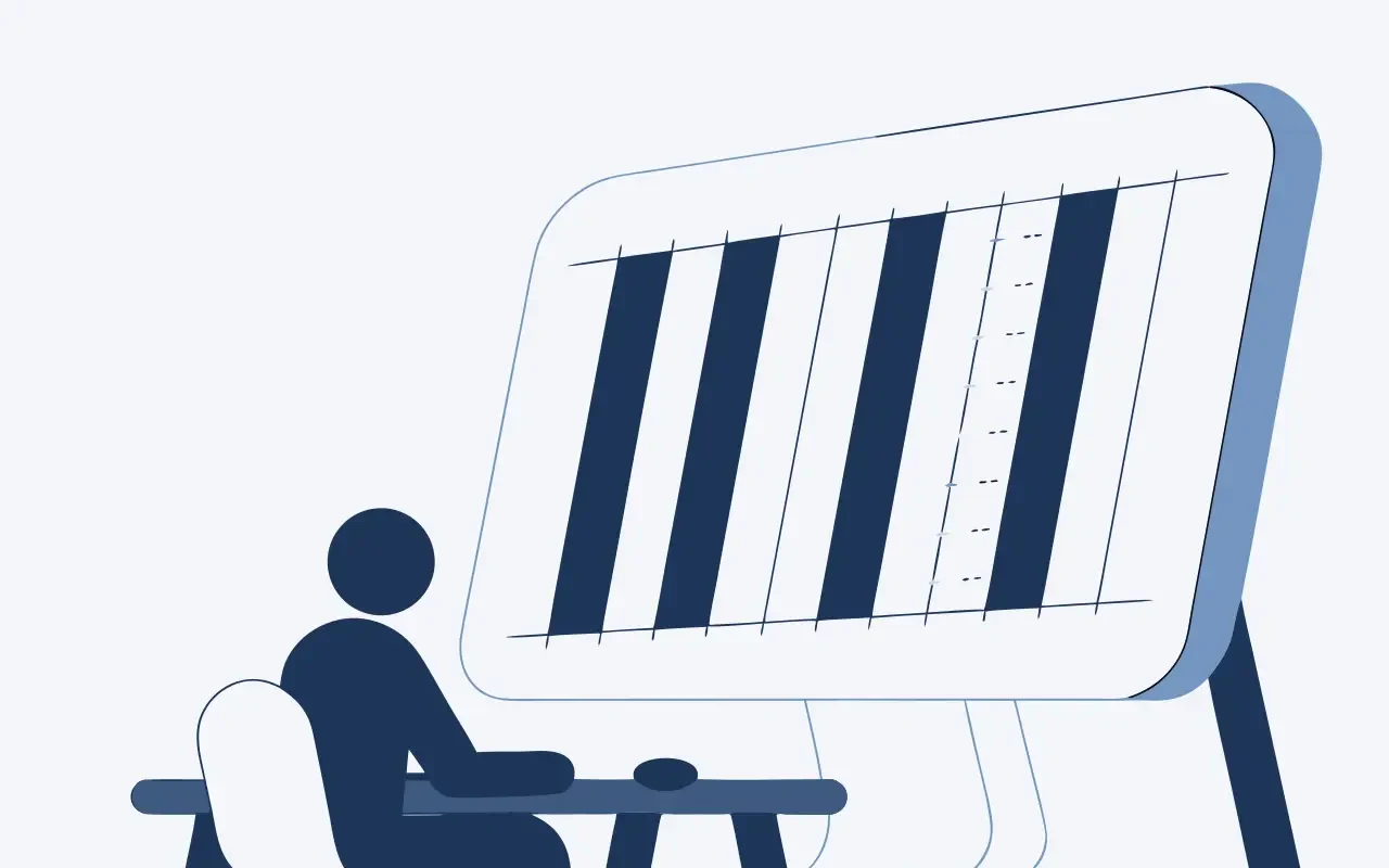 Person sitting in front of a large monitor showing a grid of layout columns.
